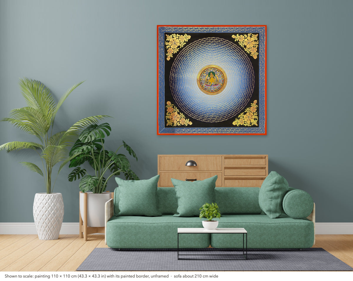 Jambhala Mantra Mandala thangka shown to scale in a living room, unframed, above a sofa about 210 cm wide (110×110 cm)