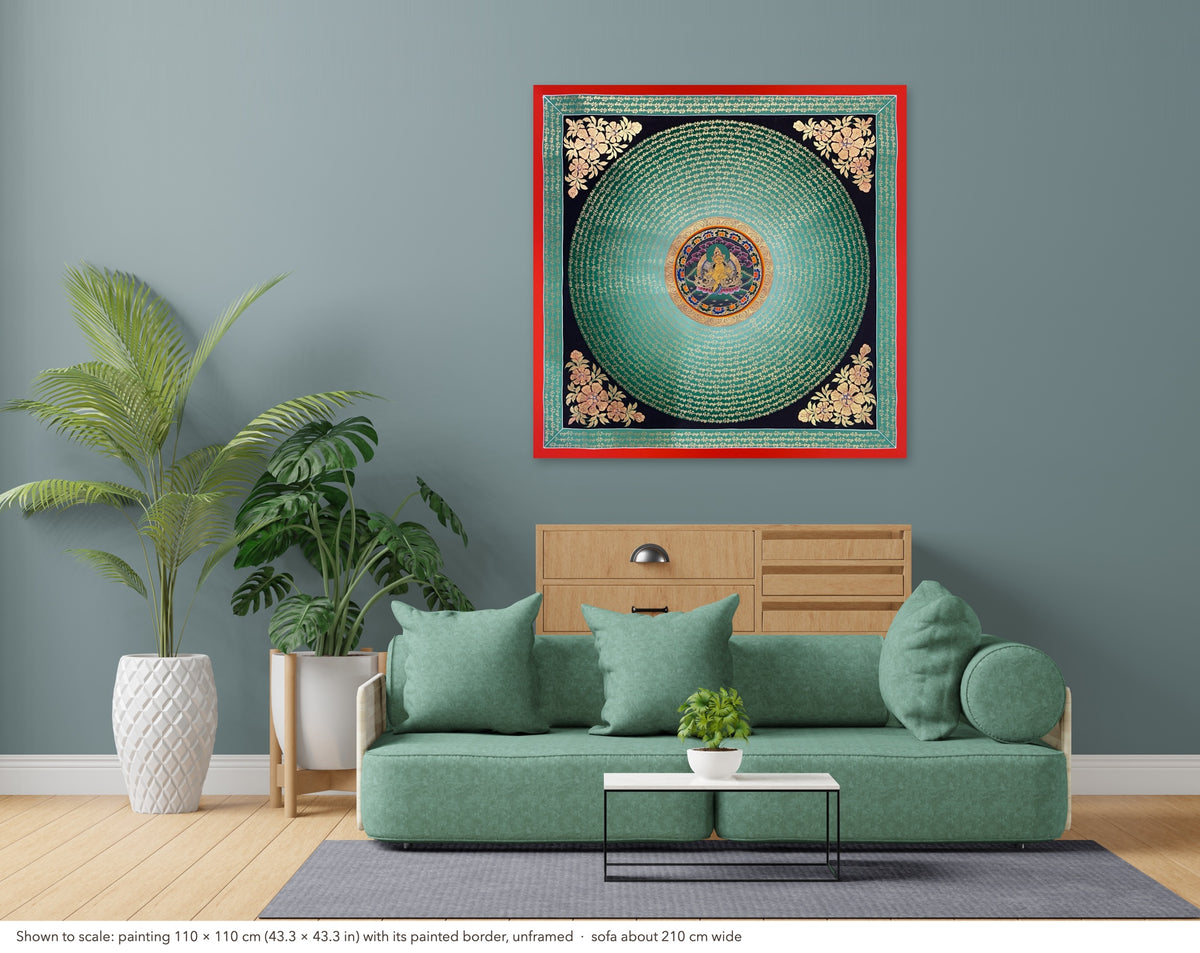 Jambhala Mantra Mandala thangka shown to scale in a living room, unframed, above a sofa about 210 cm wide (110×110 cm)