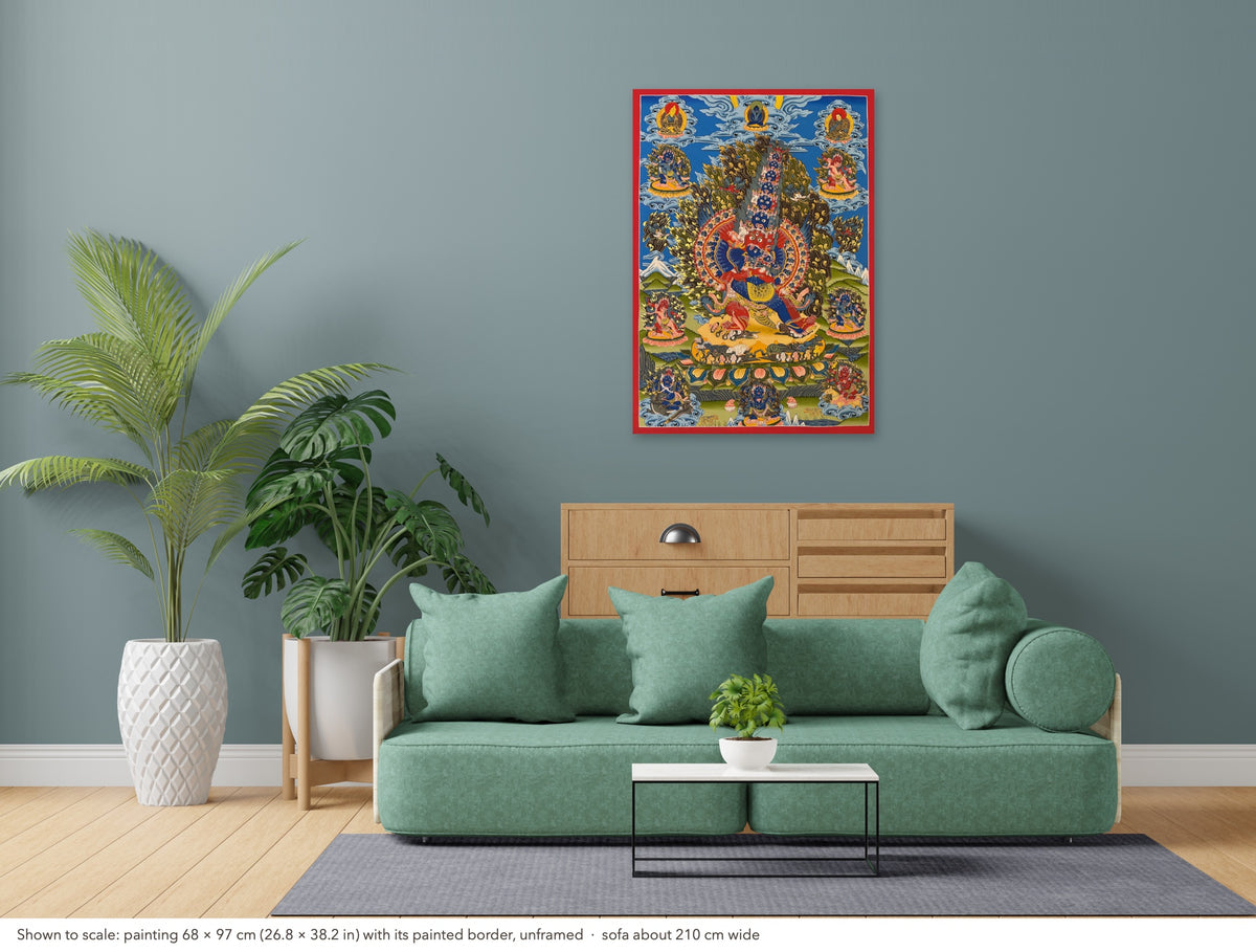 Yamantaka with Consort thangka shown to scale in a living room, unframed, above a sofa about 210 cm wide (68×97 cm)