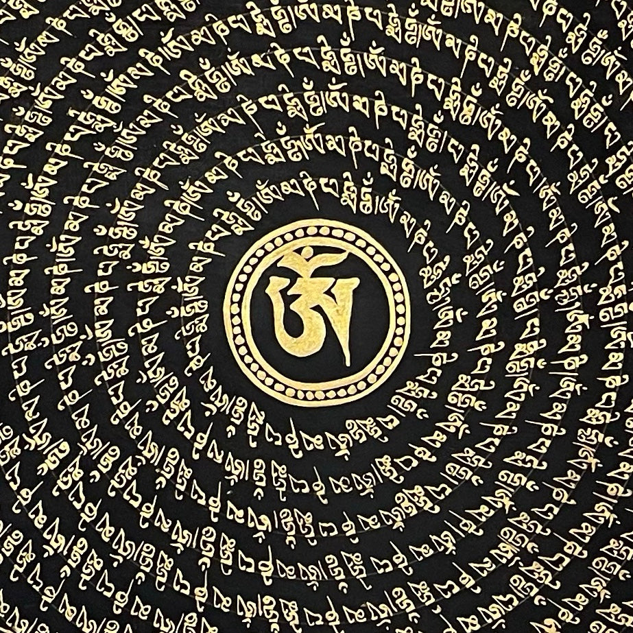 Mantra Mandala thangka, 76×76 cm: a spiral of gold-coloured mantra script on black around a central Om, with gold-coloured peonies in the corners