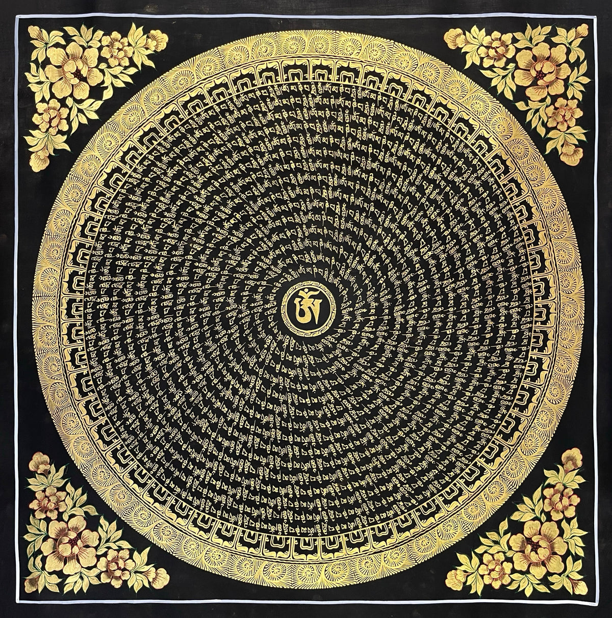 Mantra Mandala thangka, 77×77 cm: a spiral of gold-coloured mantra script on black around a central Om, with gold-coloured peonies in the corners